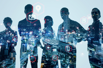 silhouettes of five professionals against a cityscape with digital icons representing technology and connectivity